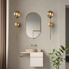 Liora Wandlamp | Gouden Metalen Frame, Glazen Bol