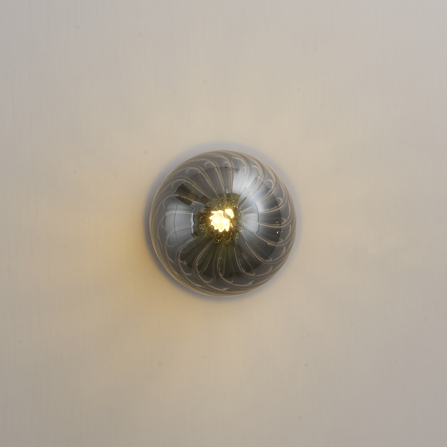 Celeste Optical Swirl Glass Wall Sconce