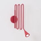 Curved Instrument-Inspired Metal Wall Lamp