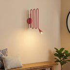 Curved Instrument-Inspired Metal Wall Lamp
