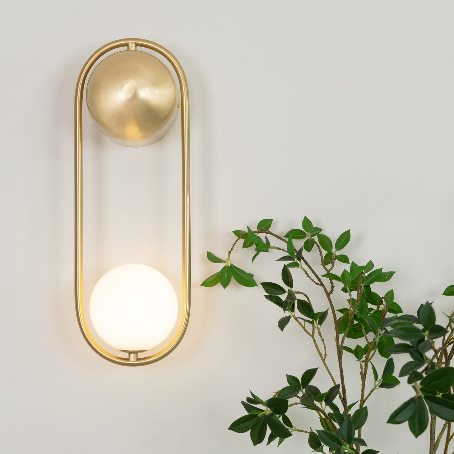 Brushed Brass Capsule Opal Orb Wall Sconce