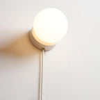 Moorsa Plug-In Glass Globe Wall Sconce