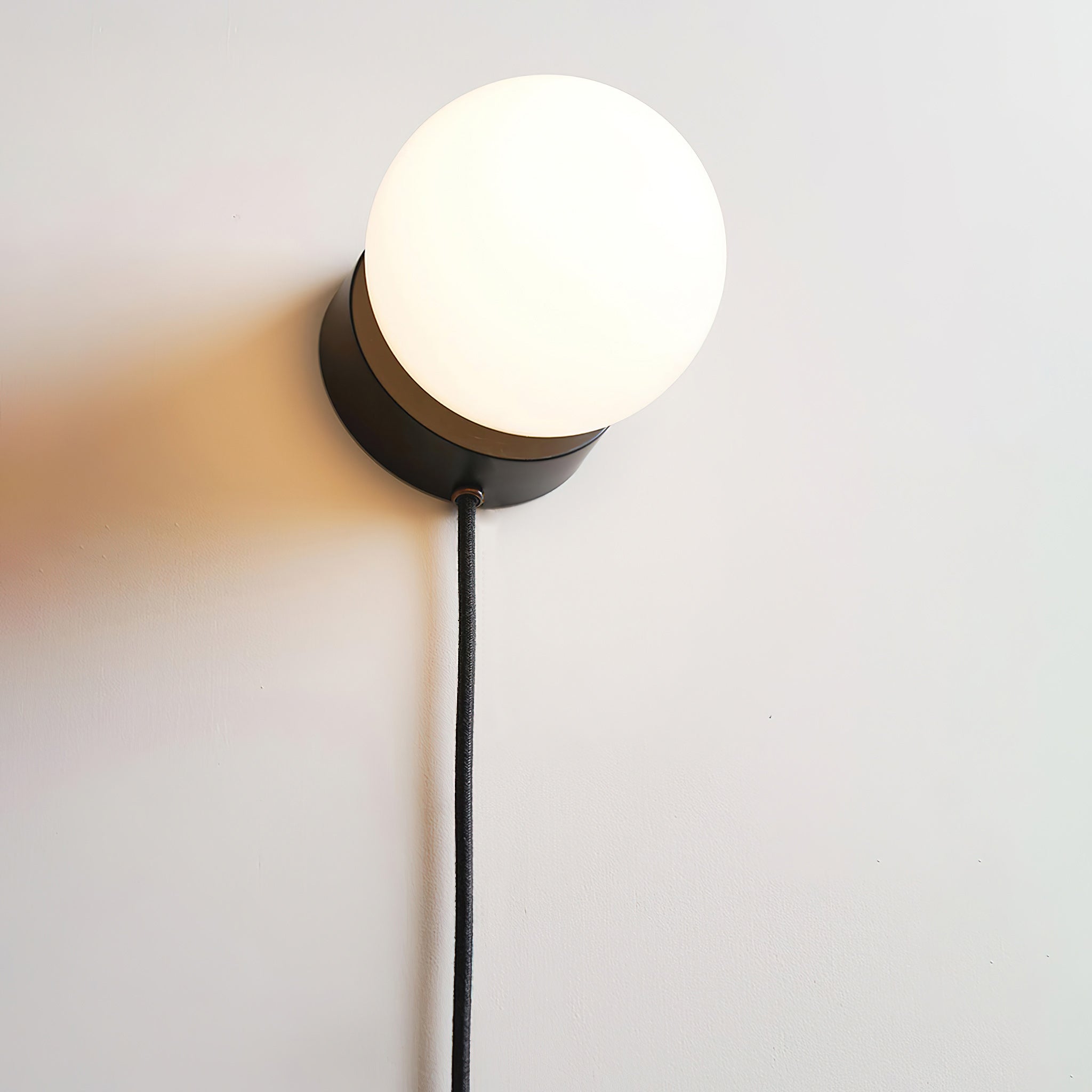 Moorsa Plug-In Glass Globe Wall Sconce