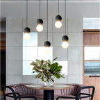 OrigoGlow: Pendant Light with Ball Structure Made of Cement & Opal Glass – for Entrance Area & Sofa Corner