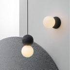 OrigoGlow: Pendant Light with Ball Structure Made of Cement & Opal Glass – for Entrance Area & Sofa Corner